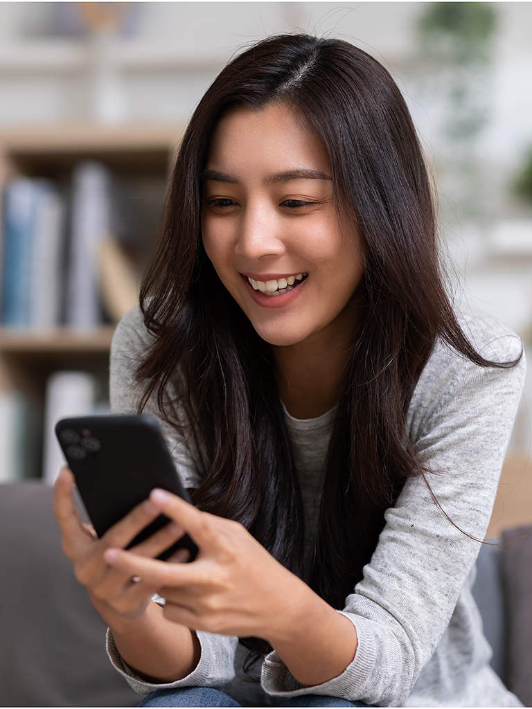 Photo of Businesswoman Smiling During Easy Mobile ERC Filing Process with 1st Capital Financial