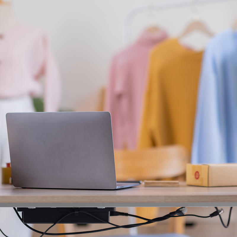 Photo of a Laptop and Supplies on a Desk in a Retail Business